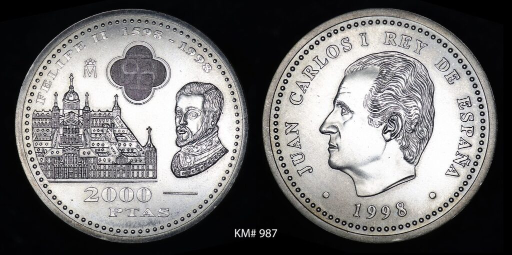 Moneda conmemorativa española de plata de 2000 pesetas de 1998, con Felipe II y El Escorial en una cara y Juan Carlos I en la otra